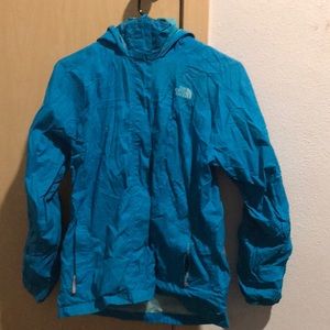 A blue north face rain jacket